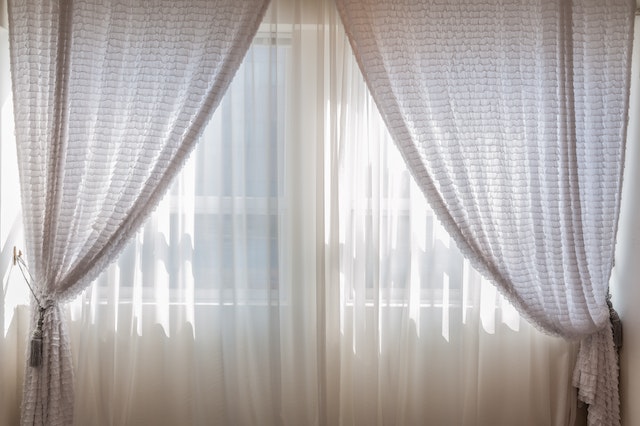 semi sheer curtains layered to provide privacy while still letting light in